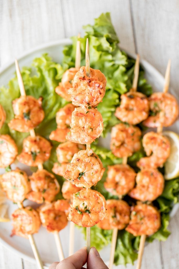 Juicy and tender grilled cajun shrimp skewers are garlicky, lemony, and packed with flavour by the cajun marinade. Ready in under 30 minutes including prep. | aheadofthyme.com