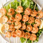 Juicy and tender grilled cajun shrimp skewers are garlicky, lemony, and packed with flavour by the cajun marinade. Ready in under 30 minutes including prep. | aheadofthyme.com