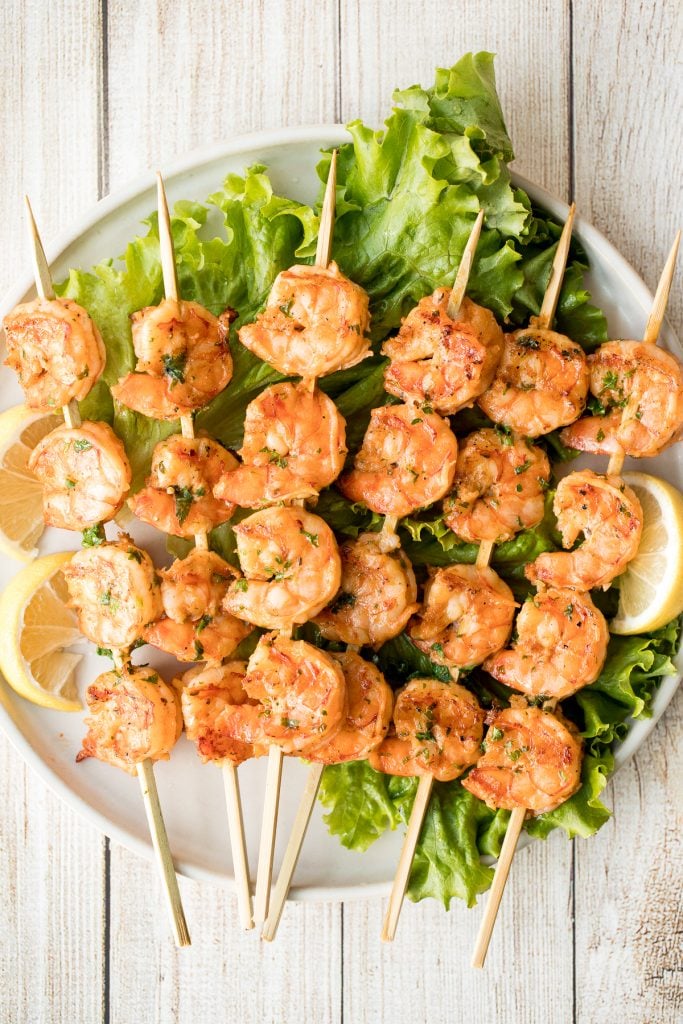 Juicy and tender grilled cajun shrimp skewers are garlicky, lemony, and packed with flavour by the cajun marinade. Ready in under 30 minutes including prep. | aheadofthyme.com