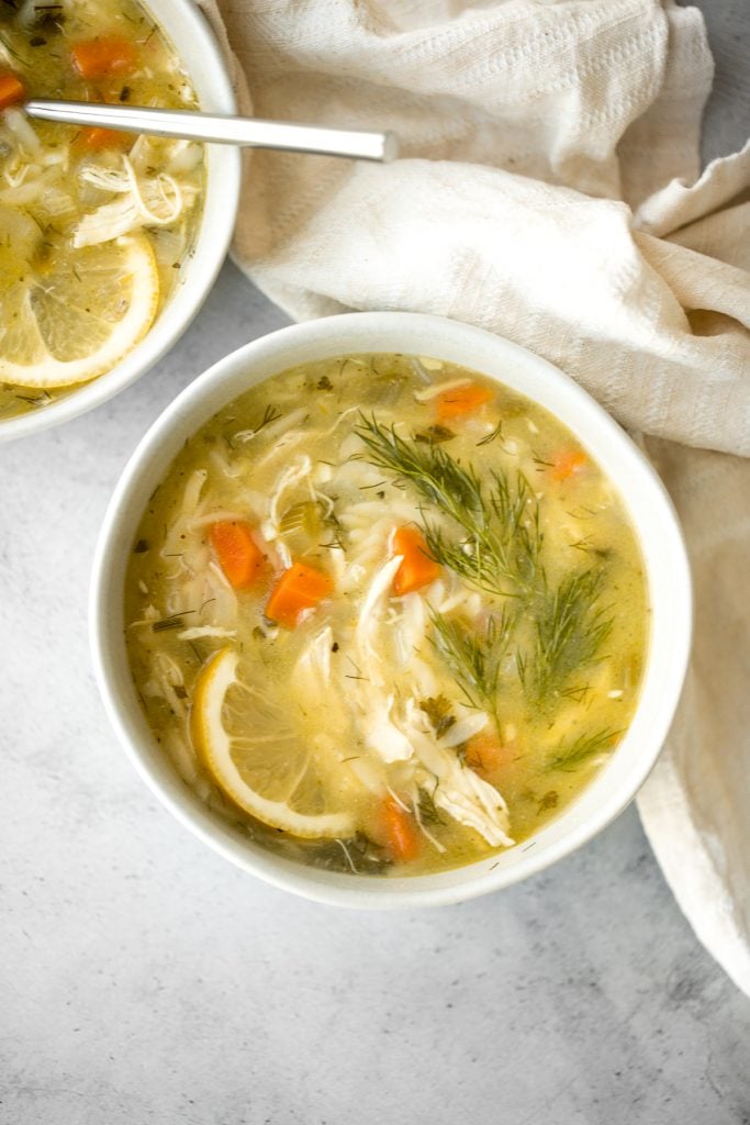 Smooth, hearty and light, one pot lemon chicken orzo soup is pure comfort in a bowl. This family favourite is like chicken noodle soup with a major upgrade. | aheadofthyme.com