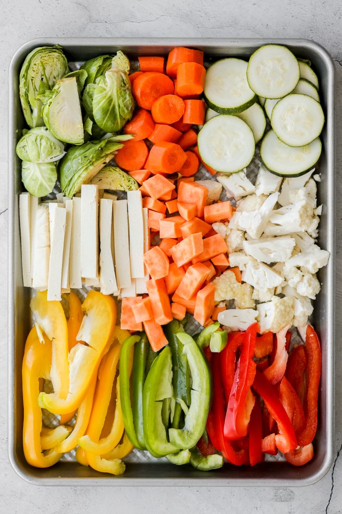 Quick and easy, throw everything into one pan, Asian-style meal prep sheet pan sesame balsamic chicken and vegetables is flavourful, juicy and tender. | aheadofthyme.com