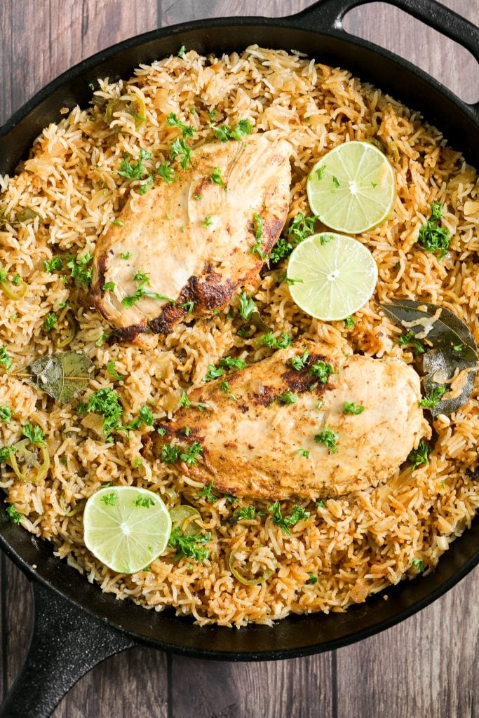 Creamy, delicious and flavourful, Thai-inspired one pot coconut curry chicken and rice is a 30-minute weeknight meal made with red curry and coconut milk. | aheadofthyme.com