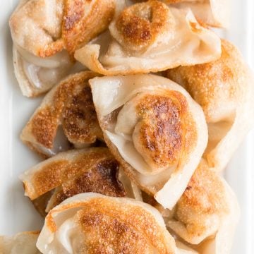 Better than takeout pan-fried pork and shrimp wontons are so crispy outside and tender and juicy inside with a savoury pork, shrimp and vegetable filling. | aheadofthyme.com