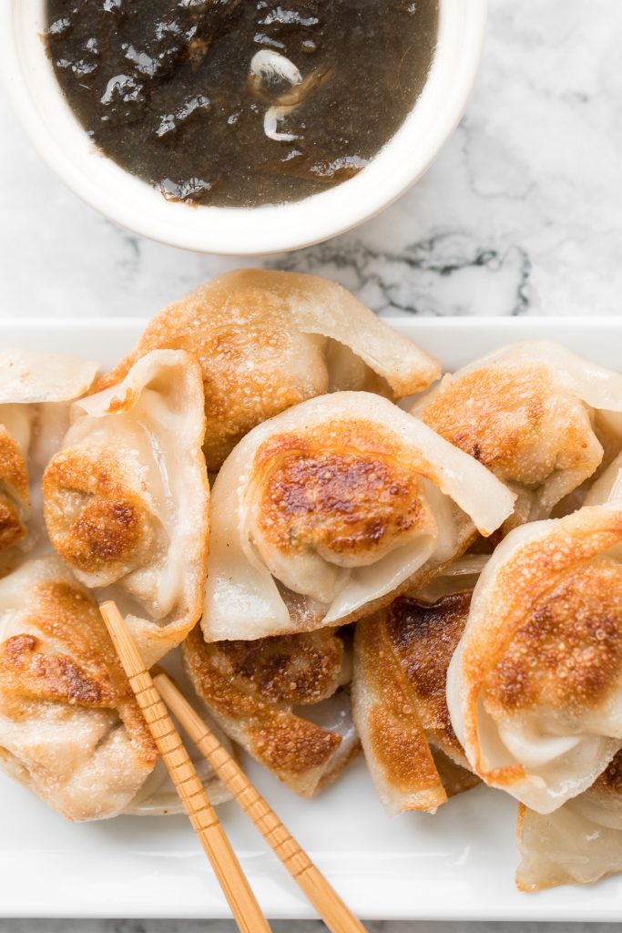 Better than takeout pan-fried pork and shrimp wontons are so crispy outside and tender and juicy inside with a savoury pork, shrimp and vegetable filling. | aheadofthyme.com