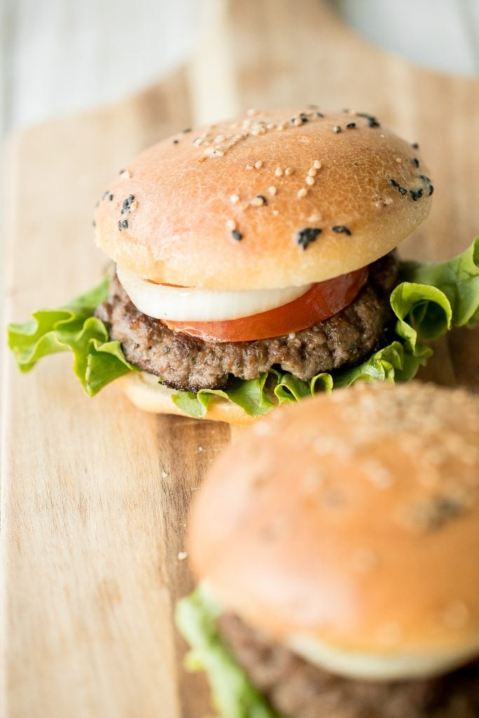 Super juicy and flavourful rosemary thyme quarter pound burgers made with fresh herbs add such an incredible depth of flavour. Just 10 minutes of prep work. | aheadofthyme.com