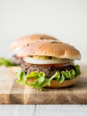 Super juicy and flavourful rosemary thyme quarter pound burgers made with fresh herbs add such an incredible depth of flavour. Just 10 minutes of prep work. | aheadofthyme.com