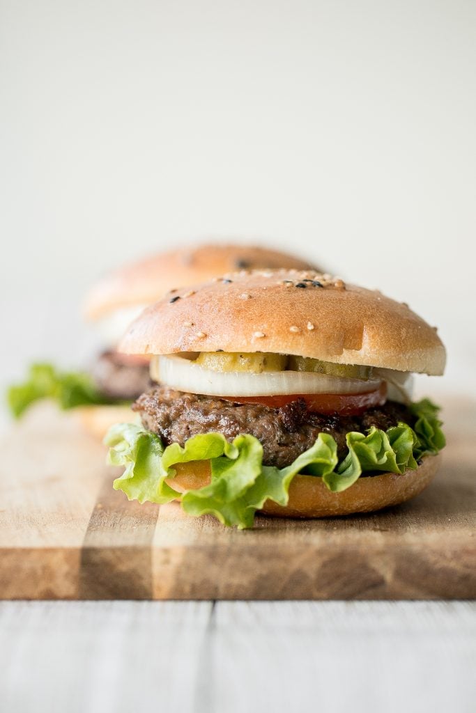 Super juicy and flavourful rosemary thyme quarter pound burgers made with fresh herbs add such an incredible depth of flavour. Just 10 minutes of prep work. | aheadofthyme.com