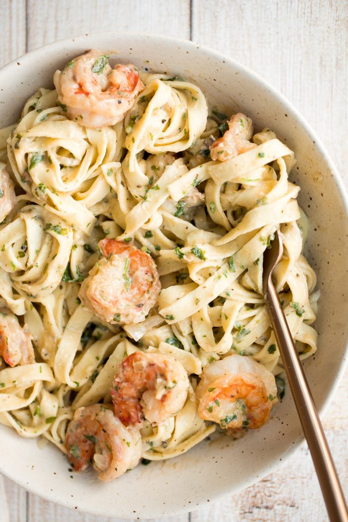 Creamy shrimp fettuccine alfredo pasta bake is garlicky, buttery, cheesy, loaded with shrimp + parsley and topped with mozzarella. Easy comfort food goals. | aheadofthyme.com