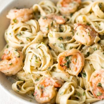 Creamy shrimp fettuccine alfredo pasta bake is garlicky, buttery, cheesy, loaded with shrimp + parsley and topped with mozzarella. Easy comfort food goals. | aheadofthyme.com