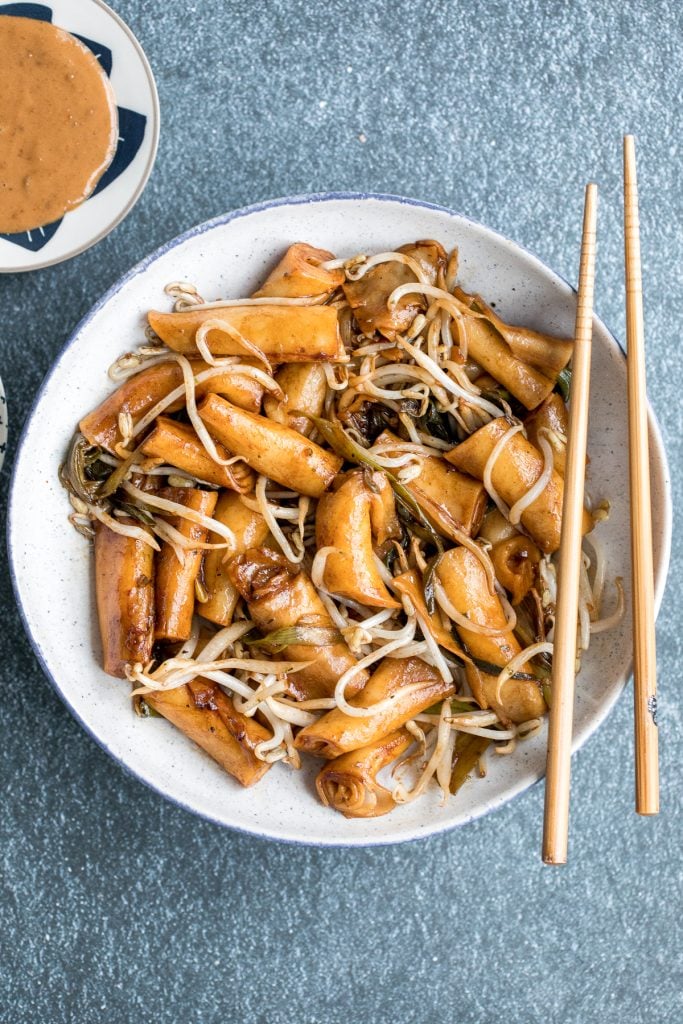 Better than takeout, quick and easy one pan stir-fried rice noodle rolls with peanut butter sauce is the best weeknight stir fry, ready in under 10 minutes. | aheadofthyme.com