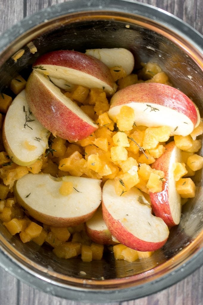 Quick, easy, one pan apple cider chicken with butternut squash, apples, and thyme, cooked in an apple cider sauce. Serve this fall meal in just 40 minutes. | aheadofthyme.com