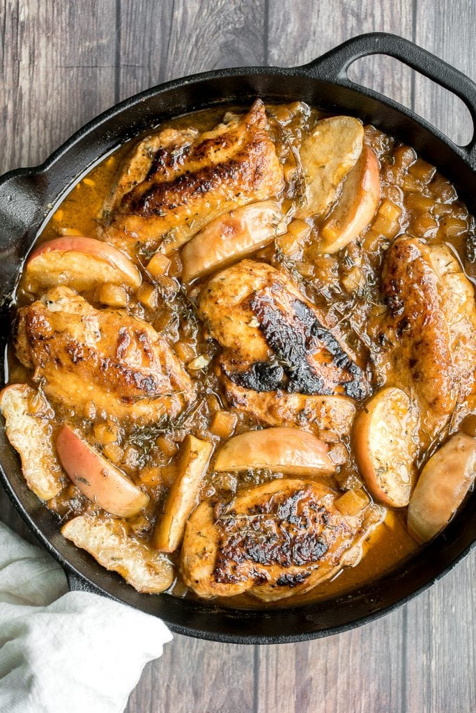 Quick, easy, one pan apple cider chicken with butternut squash, apples, and thyme, cooked in an apple cider sauce. Serve this fall meal in just 40 minutes. | aheadofthyme.com