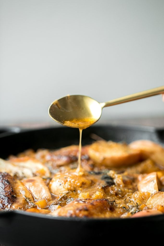 Quick, easy, one pan apple cider chicken with butternut squash, apples, and thyme, cooked in an apple cider sauce. Serve this fall meal in just 40 minutes. | aheadofthyme.com