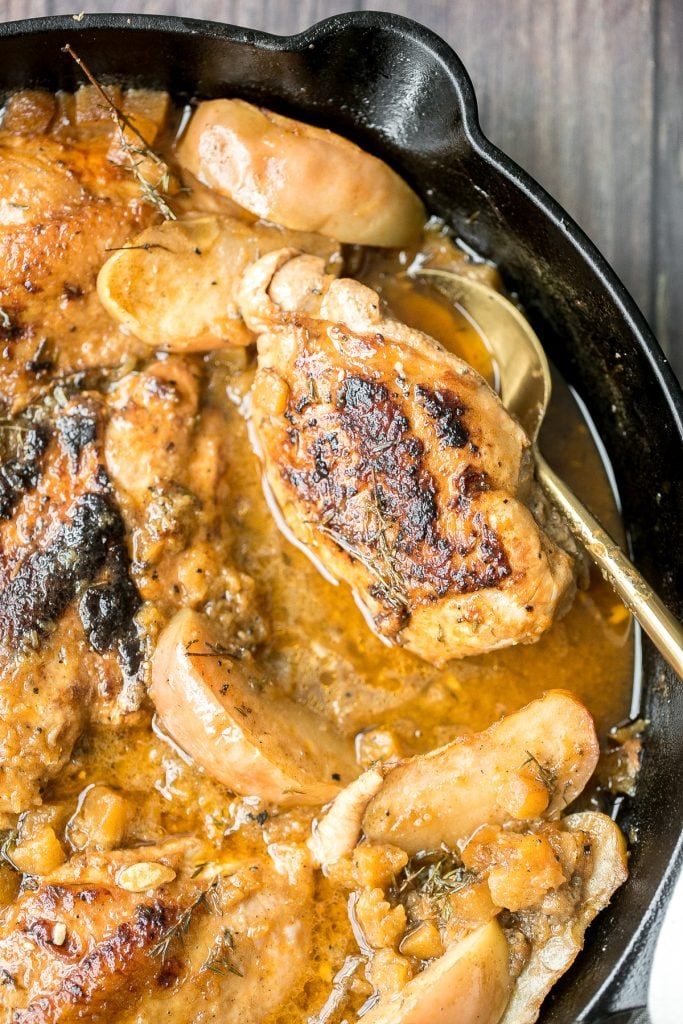 Quick, easy, one pan apple cider chicken with butternut squash, apples, and thyme, cooked in an apple cider sauce. Serve this fall meal in just 40 minutes. | aheadofthyme.com