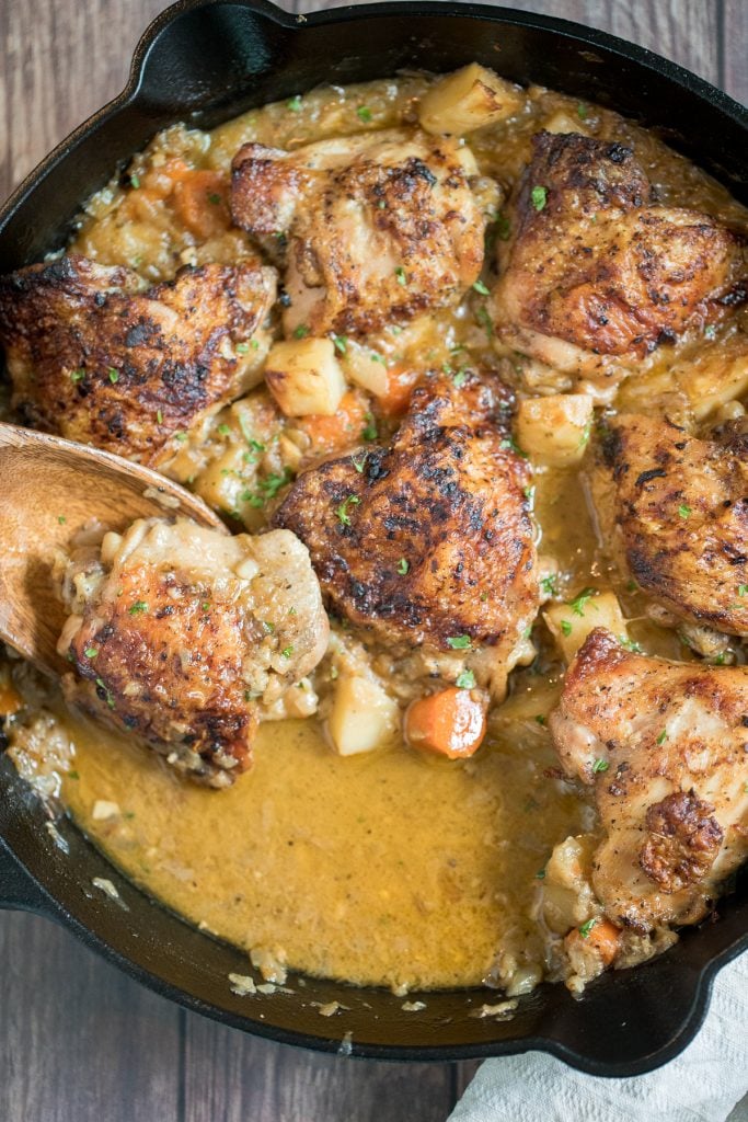 Tender and juicy apple dijon braised chicken thighs with potatoes is juicy, tender and so succulent that it falls off the bone, yet so crispy outside. | aheadofthyme.com