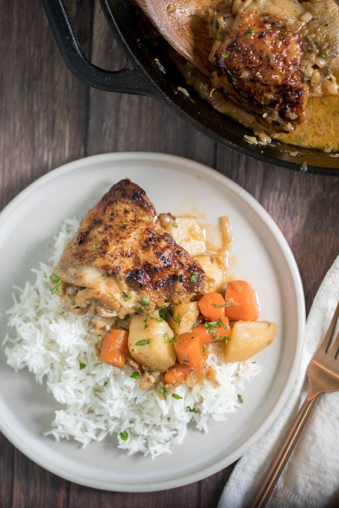 Tender and juicy apple dijon braised chicken thighs with potatoes is juicy, tender and so succulent that it falls off the bone, yet so crispy outside. | aheadofthyme.com