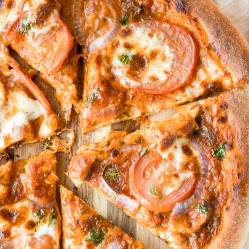 Quick, easy, delicious and saucy leftover butter chicken pizza with an ultra crispy pizza crust is made entirely in a cast-iron skillet in just 10 minutes. | aheadofthyme.com