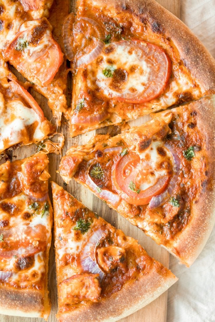 Quick, easy, delicious and saucy leftover butter chicken pizza with an ultra crispy pizza crust is made entirely in a cast-iron skillet in just 10 minutes. | aheadofthyme.com