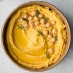 Make creamy pumpkin hummus in under 5 minutes with a few pantry staples including canned pumpkin. It's the best healthy and delicious fall snack or appy. | aheadofthyme.com