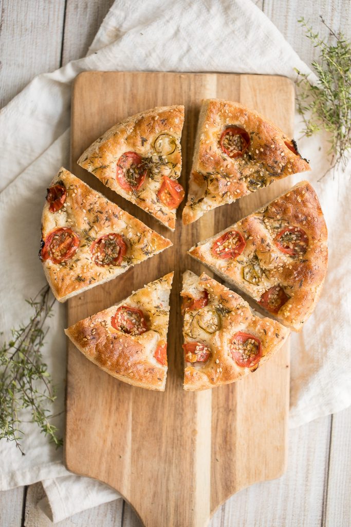 Easy no knead tomato focaccia is so flavourful, packed with olive oil, tomatoes and fresh herbs. It's crispy and golden outside, fluffy and pillowy inside. | aheadofthyme.com