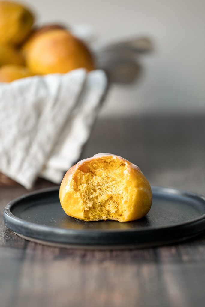 Quick and easy pumpkin dinner rolls are soft and fluffy, flaky and butter, and perfect to serve alongside a warm and cozy fall meal or Thanksgiving dinner. | aheadofthyme.com