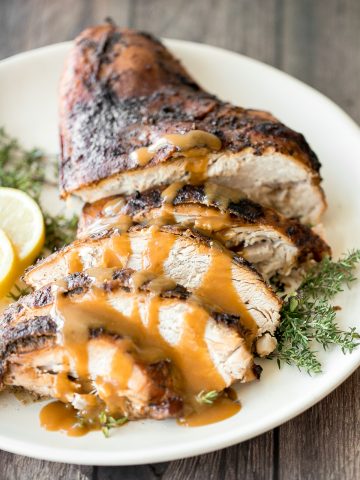 Soft, tender and juicy slow cooker turkey breast with the crispiest skin and fresh fall herbs is the easiest way to cook a turkey this holiday season. | aheadofthyme.com