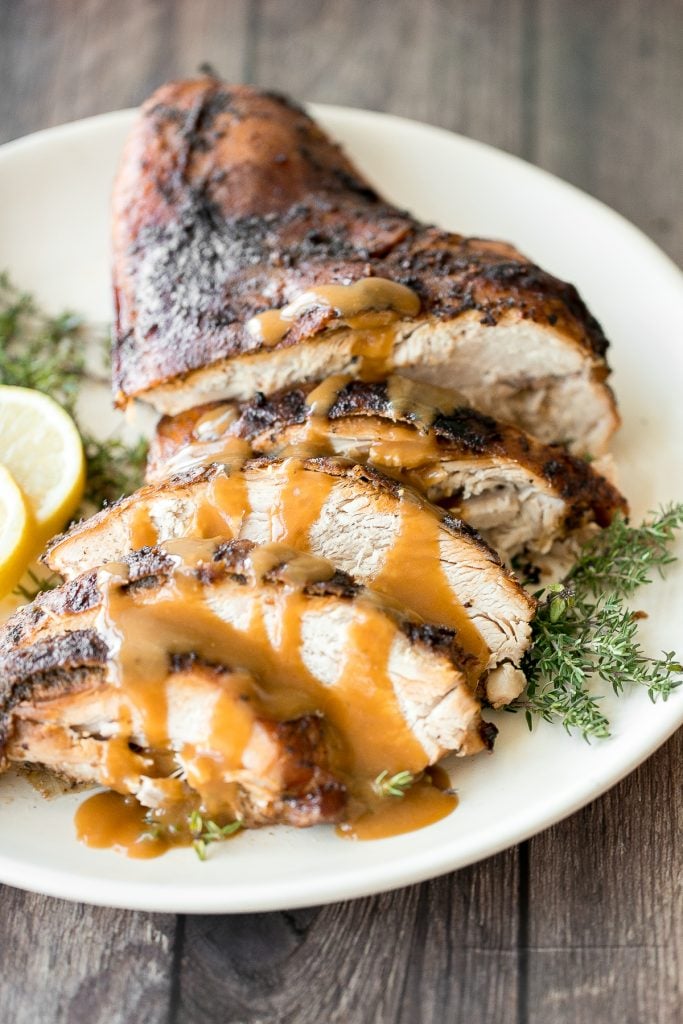 Soft, tender and juicy slow cooker turkey breast with the crispiest skin and fresh fall herbs is the easiest way to cook a turkey this holiday season. | aheadofthyme.com