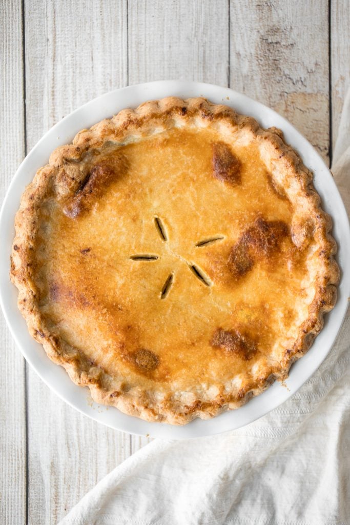 Ground beef meat pie with a flaky puff pastry double crust pie is filled with ground beef cooked with vegetables and seasonings. The ultimate comfort food. | aheadofthyme.com