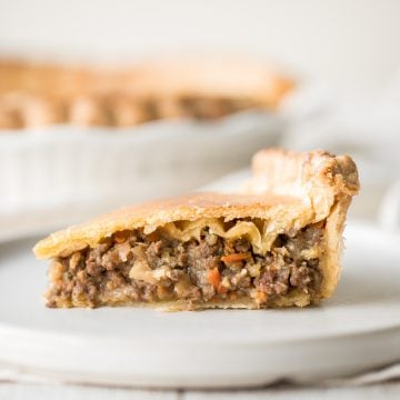 Ground beef meat pie with a flaky puff pastry double crust pie is filled with ground beef cooked with vegetables and seasonings. The ultimate comfort food. | aheadofthyme.com