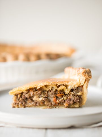 Ground beef meat pie with a flaky puff pastry double crust pie is filled with ground beef cooked with vegetables and seasonings. The ultimate comfort food. | aheadofthyme.com