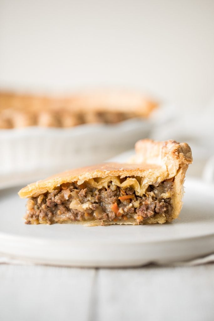 Ground beef meat pie with a flaky puff pastry double crust pie is filled with ground beef cooked with vegetables and seasonings. The ultimate comfort food. | aheadofthyme.com