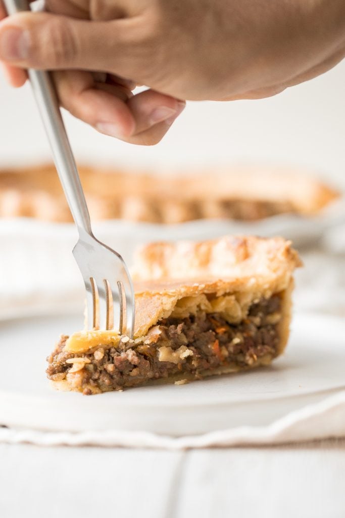 Ground beef meat pie with a flaky puff pastry double crust pie is filled with ground beef cooked with vegetables and seasonings. The ultimate comfort food. | aheadofthyme.com