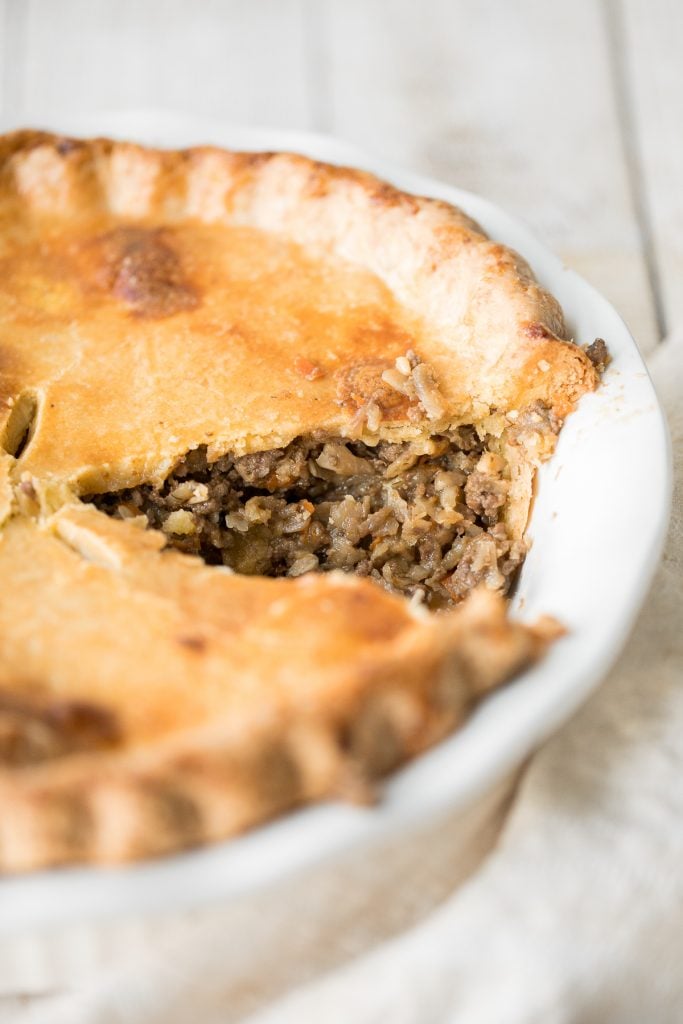 Ground beef meat pie with a flaky puff pastry double crust pie is filled with ground beef cooked with vegetables and seasonings. The ultimate comfort food. | aheadofthyme.com