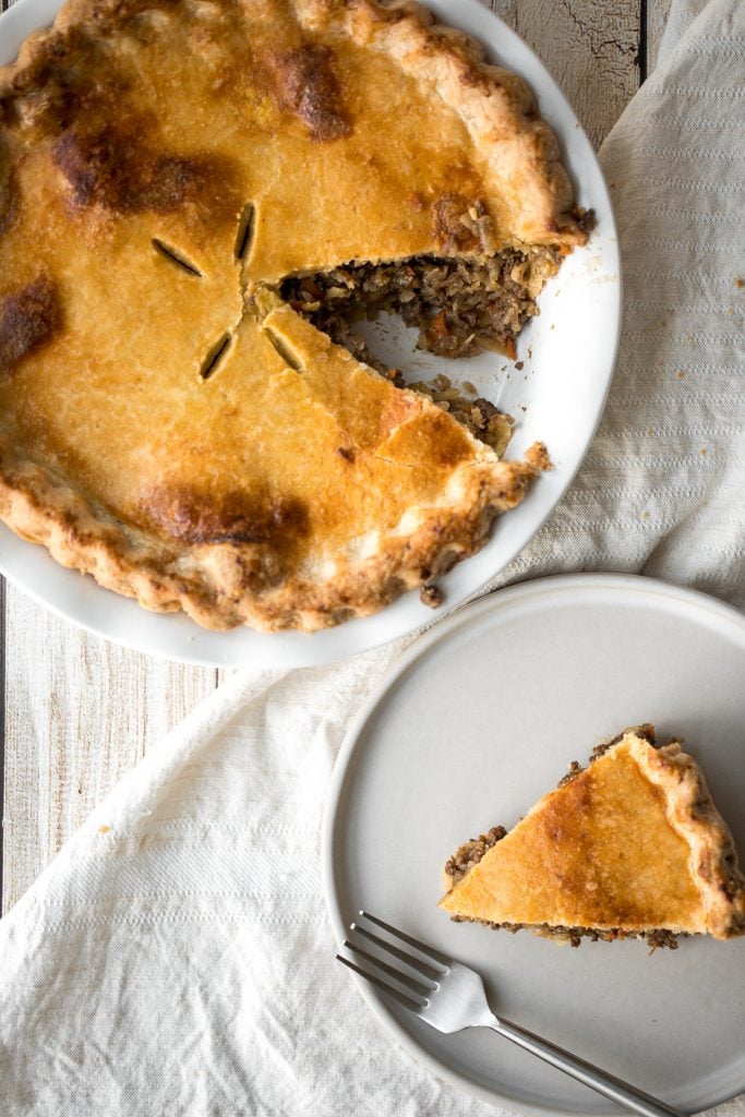 Ground beef meat pie with a flaky puff pastry double crust pie is filled with ground beef cooked with vegetables and seasonings. The ultimate comfort food. | aheadofthyme.com