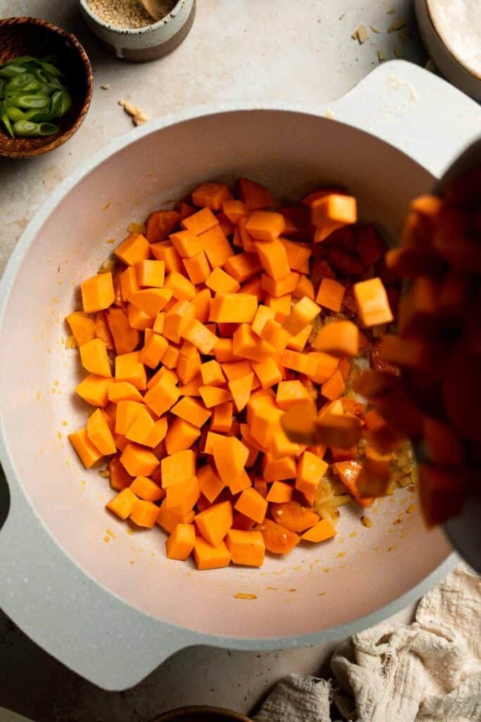 One pot Healthy Sweet Potato Soup is silky, creamy, and nourishing. Packed with cozy fall flavors, this vegan soup is ready in just 30 minutes. | aheadofthyme.com