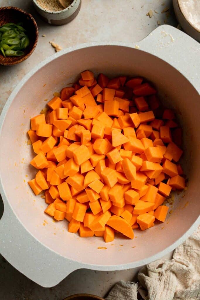 One pot Healthy Sweet Potato Soup is silky, creamy, and nourishing. Packed with cozy fall flavors, this vegan soup is ready in just 30 minutes. | aheadofthyme.com