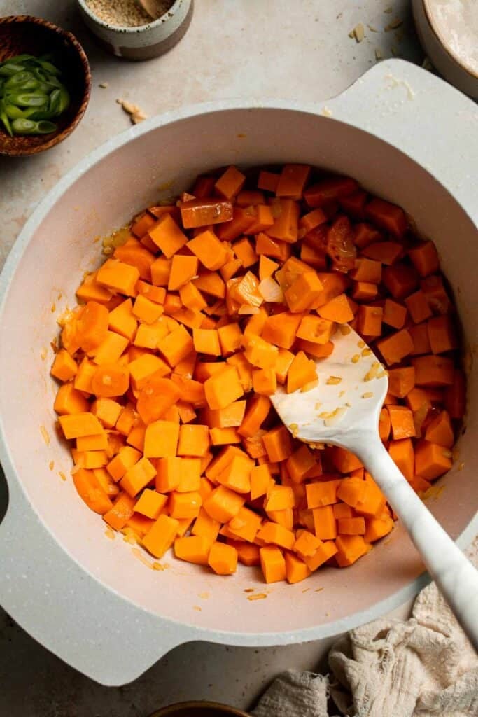One pot Healthy Sweet Potato Soup is silky, creamy, and nourishing. Packed with cozy fall flavors, this vegan soup is ready in just 30 minutes. | aheadofthyme.com