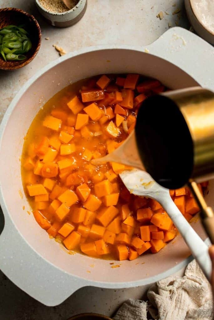 One pot Healthy Sweet Potato Soup is silky, creamy, and nourishing. Packed with cozy fall flavors, this vegan soup is ready in just 30 minutes. | aheadofthyme.com