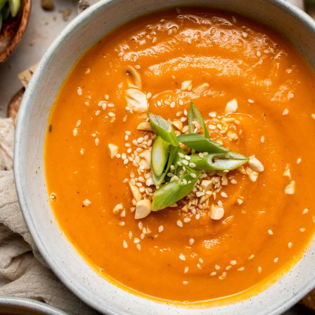 One pot Healthy Sweet Potato Soup is silky, creamy, and nourishing. Packed with cozy fall flavors, this vegan soup is ready in just 30 minutes. | aheadofthyme.com