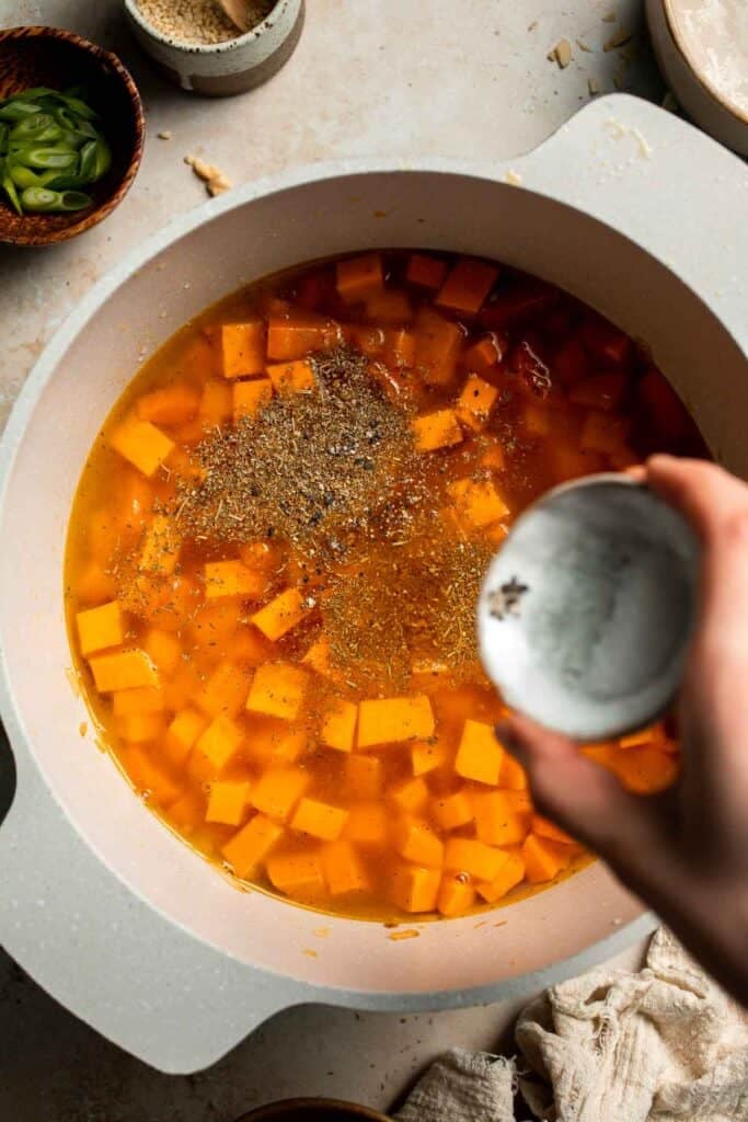 One pot Healthy Sweet Potato Soup is silky, creamy, and nourishing. Packed with cozy fall flavors, this vegan soup is ready in just 30 minutes. | aheadofthyme.com