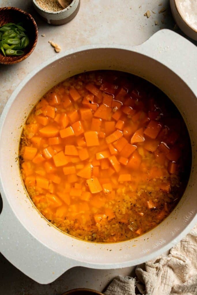 One pot Healthy Sweet Potato Soup is silky, creamy, and nourishing. Packed with cozy fall flavors, this vegan soup is ready in just 30 minutes. | aheadofthyme.com