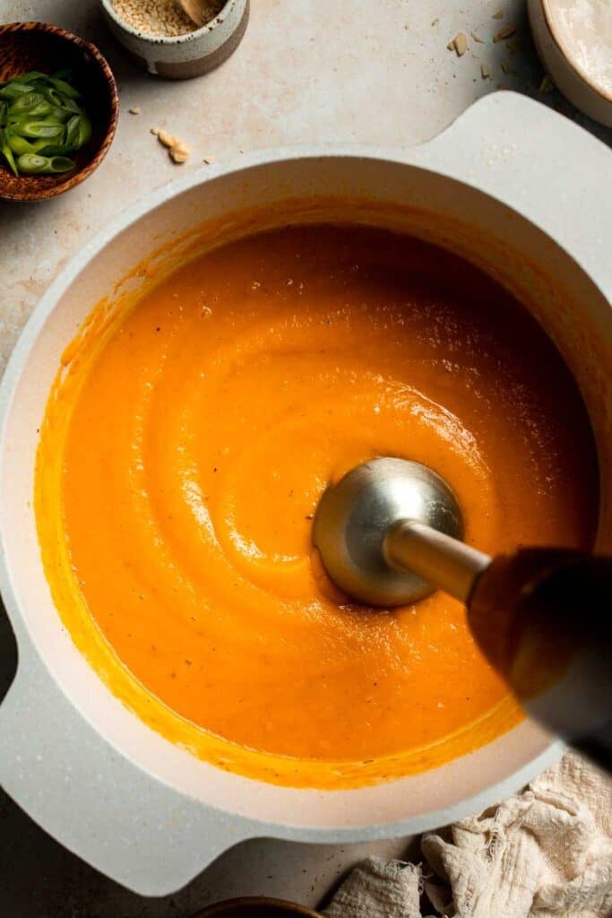 One pot Healthy Sweet Potato Soup is silky, creamy, and nourishing. Packed with cozy fall flavors, this vegan soup is ready in just 30 minutes. | aheadofthyme.com