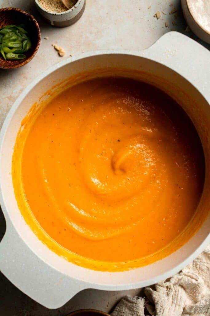 One pot Healthy Sweet Potato Soup is silky, creamy, and nourishing. Packed with cozy fall flavors, this vegan soup is ready in just 30 minutes. | aheadofthyme.com