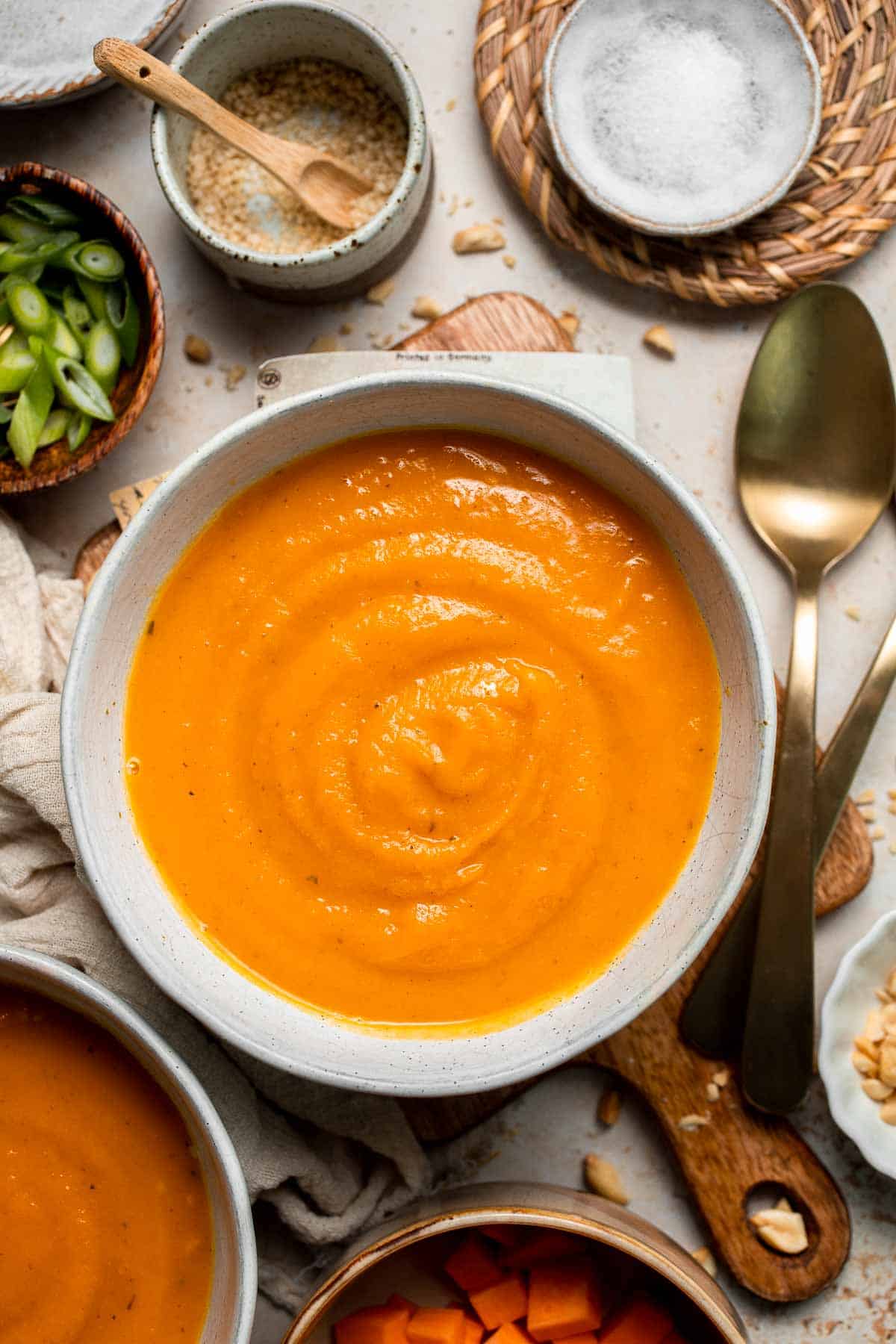 One pot Healthy Sweet Potato Soup is silky, creamy, and nourishing. Packed with cozy fall flavors, this vegan soup is ready in just 30 minutes. | aheadofthyme.com