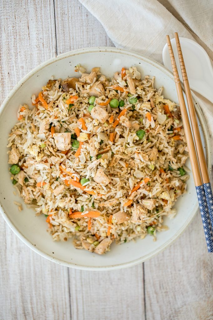 Leftover turkey fried rice with turkey, fluffy rice, scrambled eggs, vegetables, and classic Asian seasonings is a one skillet meal made in just 10 minutes. | aheadofthyme.com