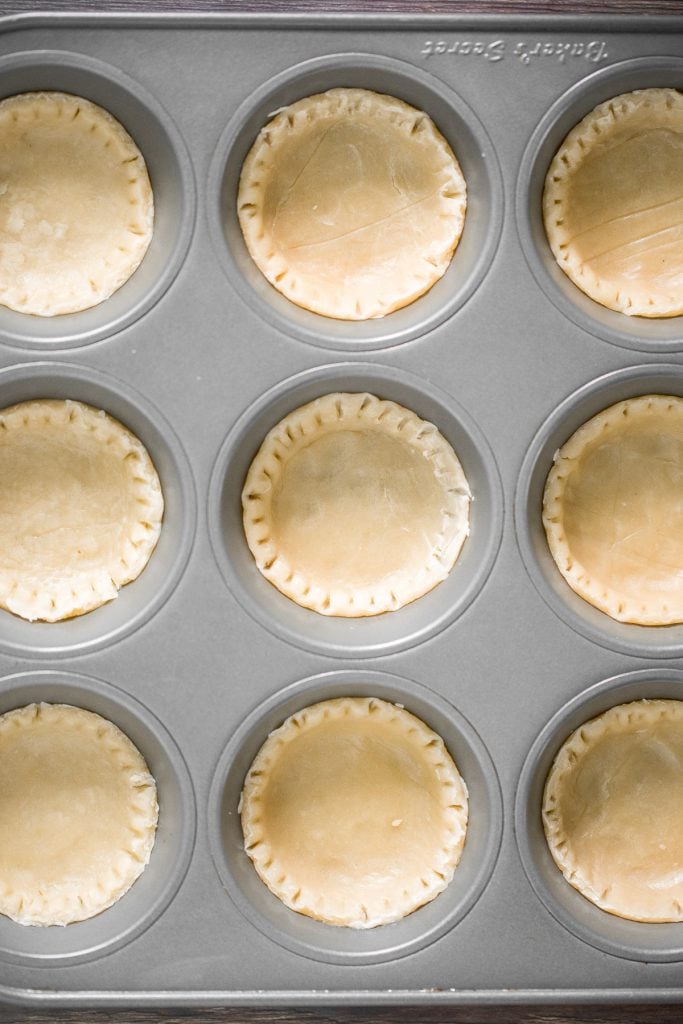 Small batch mini pumpkin pies with a flaky crust, delicious pumpkin pie filling, and cinnamon whipped cream, are perfect for a small Thanksgiving crowd. | aheadofthyme.com