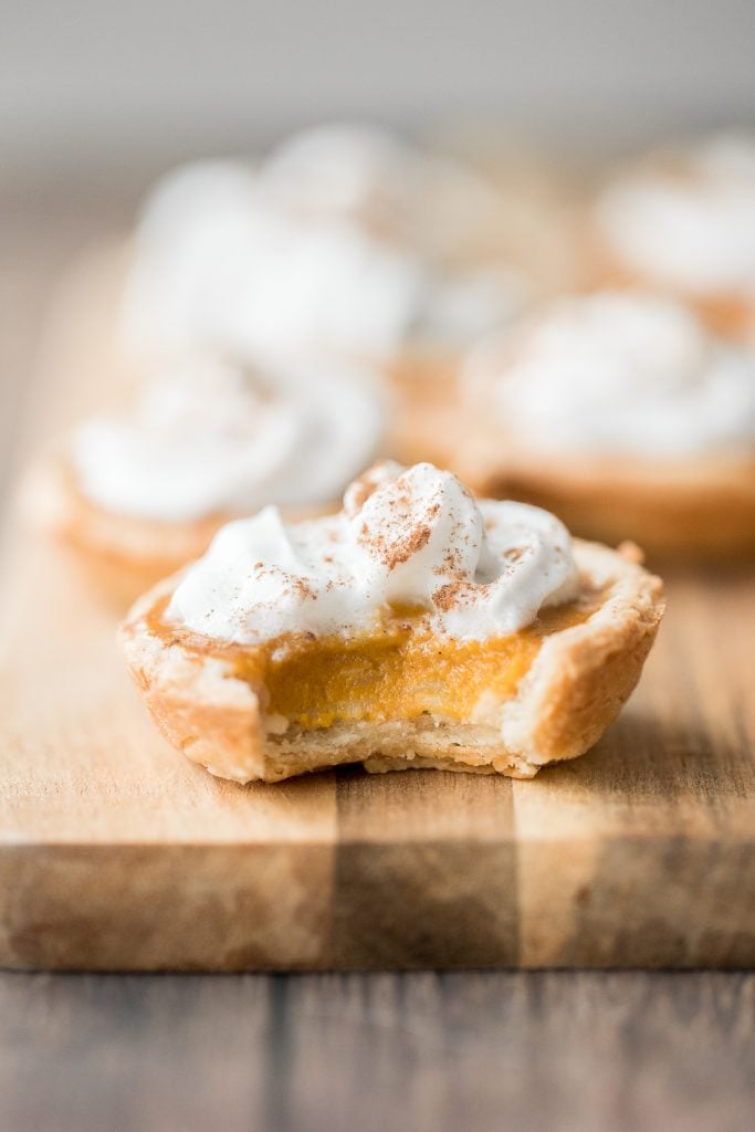 Small batch mini pumpkin pies with a flaky crust, delicious pumpkin pie filling, and cinnamon whipped cream, are perfect for a small Thanksgiving crowd. | aheadofthyme.com