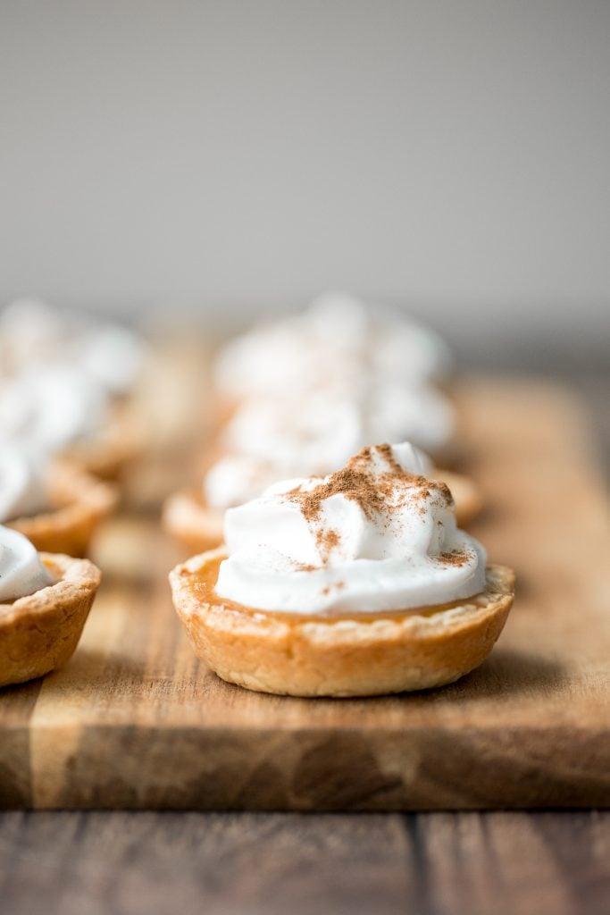 Small batch mini pumpkin pies with a flaky crust, delicious pumpkin pie filling, and cinnamon whipped cream, are perfect for a small Thanksgiving crowd. | aheadofthyme.com