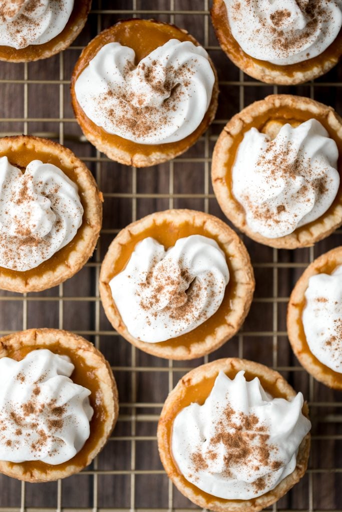 Small batch mini pumpkin pies with a flaky crust, delicious pumpkin pie filling, and cinnamon whipped cream, are perfect for a small Thanksgiving crowd. | aheadofthyme.com