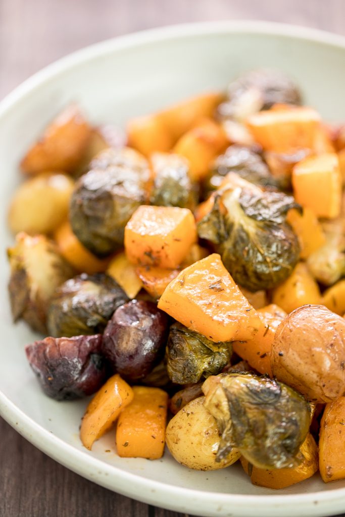 One pan roasted harvest vegetables with butternut squash, brussels sprouts and baby potatoes is the best fall side dish. So easy to prep in just minutes. | aheadofthyme.com